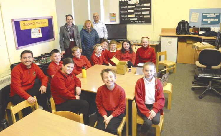 TOP GEAR: Headteacher Nicky Wright, Edge Hotel landlady Fiona Coastworth and Amit Kumar, from Cummins, with the year 5 group