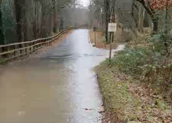The single-lane Redford Lane was flooded during Storms Bert and Darrah