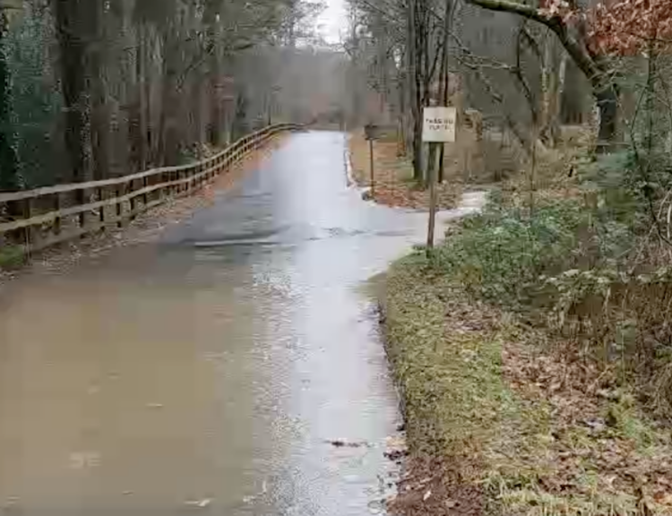 The single-lane Redford Lane was flooded during Storms Bert and Darrah