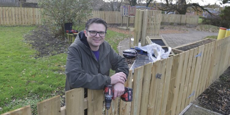 AT THE HELM: Centre manager John Bogle works to put together a picnic table for the wildlife wellbeing garden at the Randolph Centre TM pic