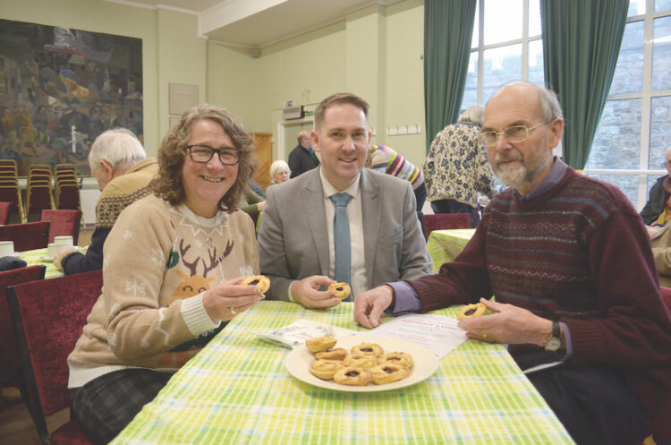 SWEET TREATS: Ronni Moore, Christian Aid church engagement and fundraising officer for the North East and Cumbria, MP Sam Rushworth and local Christian Aid organiser Alan Coustick tuck into mince pies at the last of this year’s advent lunches TM pic