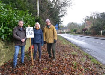 SLOW DOWN: Whorlton Traffic Calming Group members Malcolm Lockyear and Alison Boddy with parish council chairman George Statsny at the T-junction where there has been a spate of collisions and near-misses