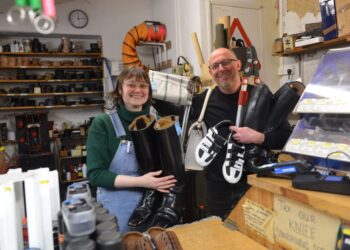 COBBLERS’ LAST: Adrian Andrews and assistant Hannah with a variety of items they have repaired or sharpened