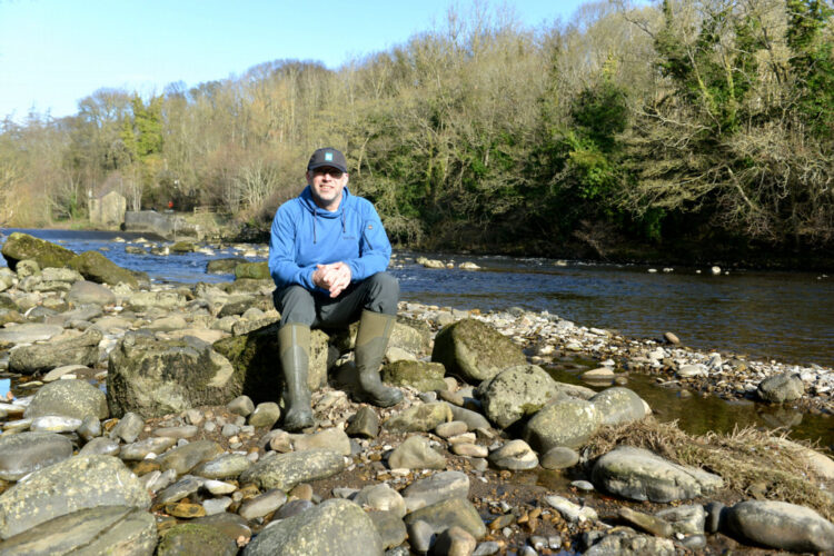GONE FISHING: Barnard Castle Angling Club secretary Gareth Hinchcliffe at his favourite spot along the River Trees, just below the town’s ancient fortress