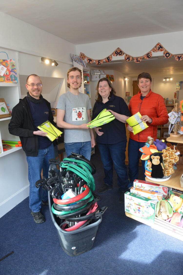 CLEANING UP: Josh Jenkins and Pauline Connelly look on as George O’Brien hands over the litter-picking equipment to Laura Drew