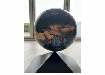 School on top of world after symbol reinstated on roof