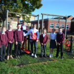 Weightlifting champion tackles school’s new gym equipment