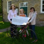 Rallying round with auction of promises
