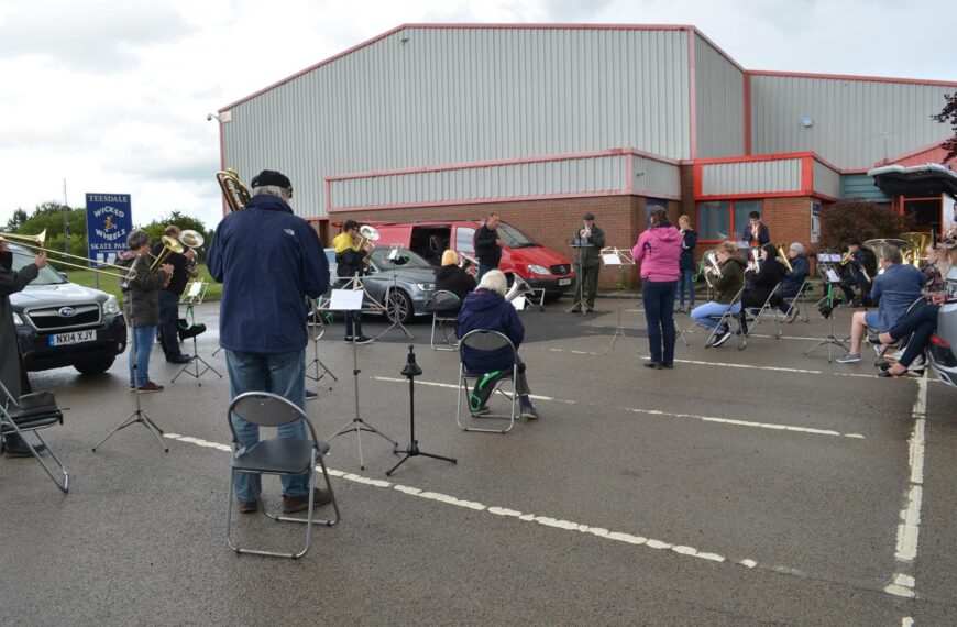 Barney band members attempt to avoid a socially distanced soaking